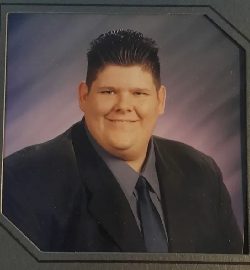 A younger Tony Ward before his weight loss transformation, wearing a suit and smiling