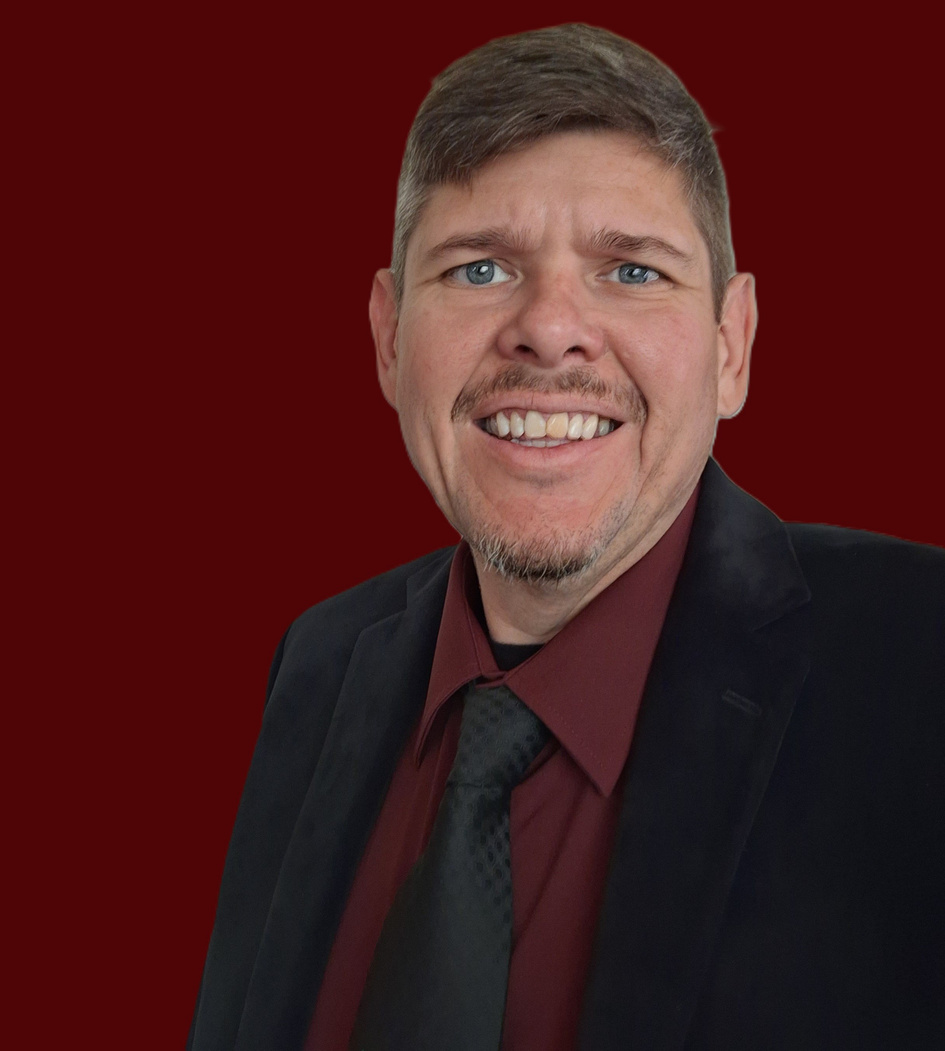 Tony Ward smiling in a suit and tie, Christian author and speaker